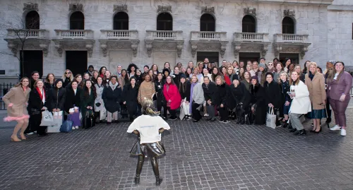 WWIW group standing in front of Fearless Girl statue