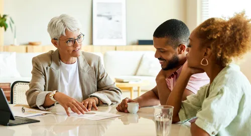 Advisor meeting with middle aged married couple