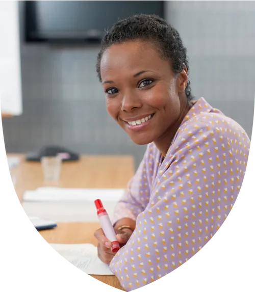 Female financial professional smiling at the table