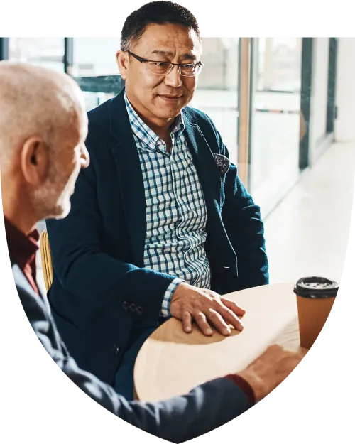 Middle aged man speaking with an advisor