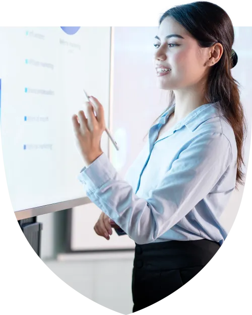 Businesswoman writing notes on a white board