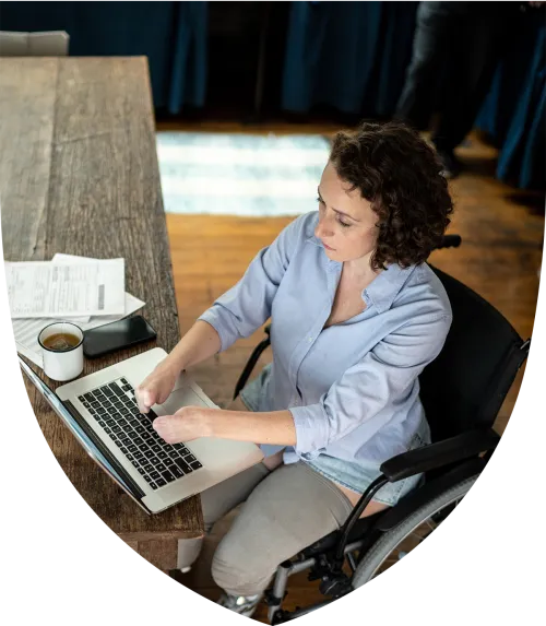 Middle aged woman with special needs sitting at her desk working