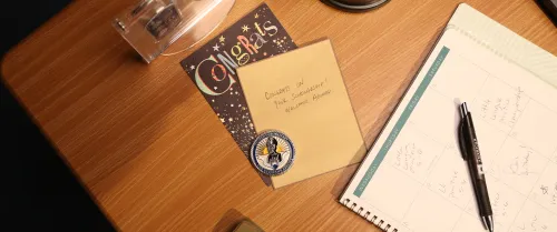 Hand written congratulations note on a table