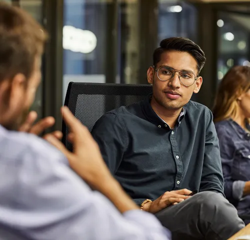 Two male colleagues having a meeting together
