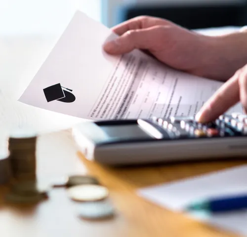 Man using a calculator at his desk
