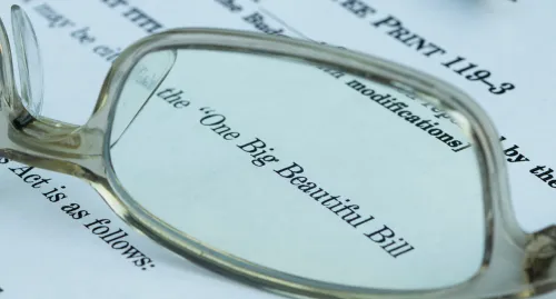 Eye glasses laying on top of an open letter