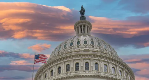 The US capitol building at sunset