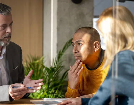 Male financial advisor speaking to a client